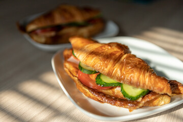 fresh croissants stuffed with omelet carbonade for breakfast