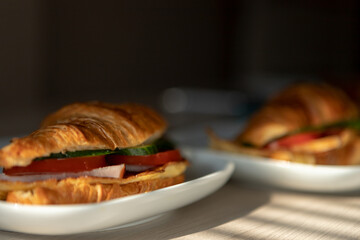 fresh croissants stuffed with omelet carbonade for breakfast