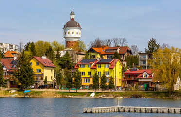 Panoramic view of Elk town center with historic water tower Wieza Cisnien at Jezioro Elckie lake shore in Masuria region of Poland - obrazy, fototapety, plakaty