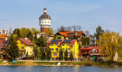 Panoramic view of Elk town center with historic water tower Wieza Cisnien at Jezioro Elckie lake shore in Masuria region of Poland