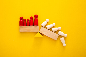 Team standing on a wooden seesaw, one side winner and one side loser. Success and failure. Business...