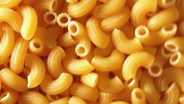 Uncooked Chifferi Rigati Pasta - Top View, Low Key. Fat and Unhealthy Food. Classic Dry Macaroni, Rotating Background. Italian Culture and Cuisine. Raw Golden Pasta Texture - Side Rotation Right