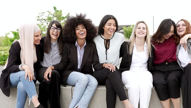 group of happy multiracial business women smiling outdoors, multicultural businesspeople having fun outdoors