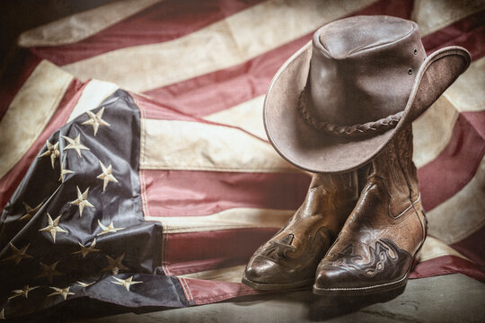 Vintage american flag, cowboy hat and boots, independence or memorial day concept