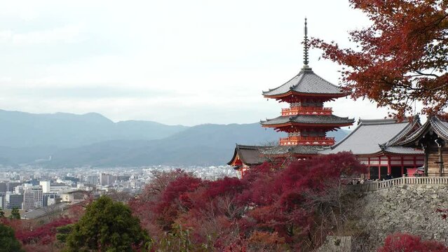 KYOTO, JAPAN - DECEMBER 2021 : View around Kiyomizudera (Kiyomizu Temple) in autumn leaves season. The temple is part of the Historic Monuments of Ancient Kyoto UNESCO World Heritage site.