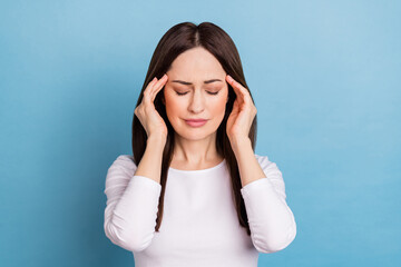 Photo of unhappy young brunette lady headache wear white pullover isolated on blue color background