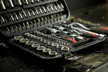 Open set box with working tools different types of metal steel heads and bits at the workshop, Interchangeable screwdriver set.