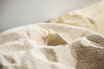 transparent pyramid on the yellow sand