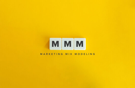 Marketing Mix Modeling (MMM) Banner. Letter Tiles On Yellow Background. Minimal Aesthetics.