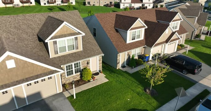 Duplex homes in USA. New modern housing American suburb. AErial in sunny light.