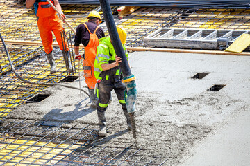 Concrete pouring on the construction site.