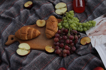 picnic with grapes, apples, plums, baking