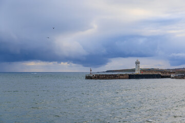 A scenic view of the Buckie, Moray, Scotland port  with a dramatic stormy sky and choppy sea