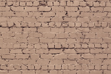 Old rough dirty exterior brick wall texture. Beige shabby messy brickwork. Light brown abstract grunge background