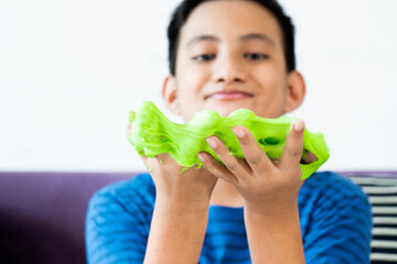 Homemade Toy Called Slime, Kids having fun and being creative by science experiment