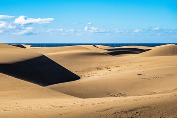 Fototapeta na wymiar Maspalomas Sand Dunes on the south coast of the island of Gran Canaria, Canary Islands, Spain