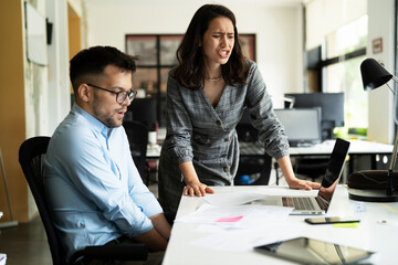 Colleagues arguing in office. Angry businesswoman yelling at her collegue.