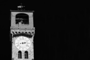 Lucca medieval 'Torre delle Ore', the city old clock tower (Black and White with copy space)