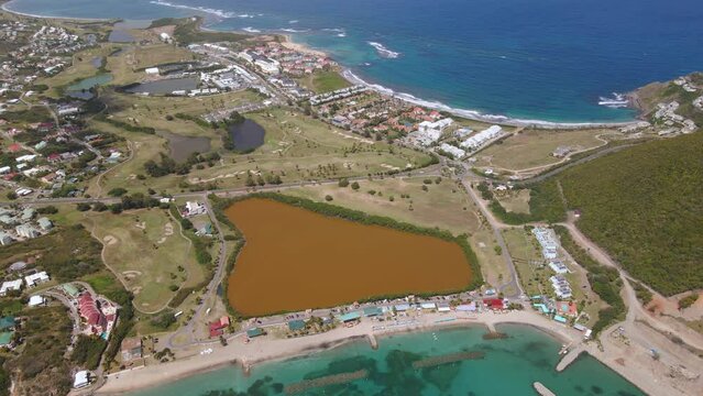 Aerial view overlooking the city of Basseterre, in sunny Saint Kitts and Nevis - pan, drone shot