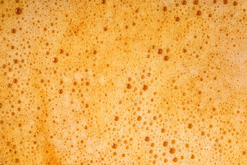 Coffee milk foam. Background texture of cappuccino, closeup. Macro.
