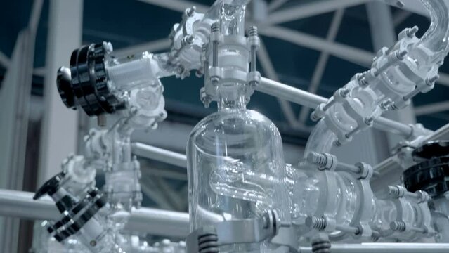 The operation of a complex and expensive chemical reactor in a laboratory for production for products in the medical, chemical, cosmetic industries. Closeup. Shot in motion