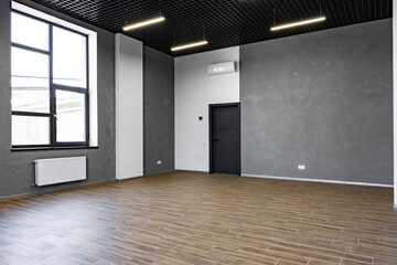 Empty open space office room with window