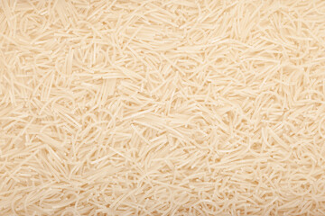 Gluten-free pasta made from rice flour, close-up. Vermicelli. Texture of uncooked white pasta. Design element