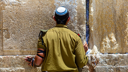 An Israeli soldier prays at the Western Wall