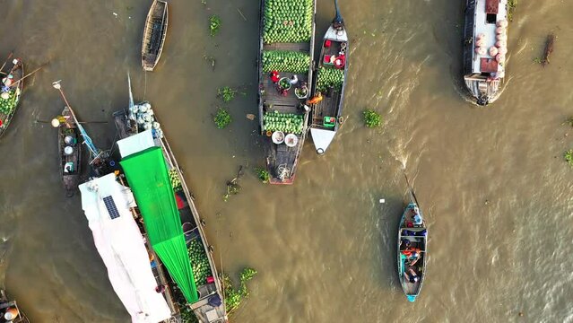 A top view of Cai Rang Floating Market in Asia, Vietnam, Mekong Delta, Can Tho, in summer on a sunny day.