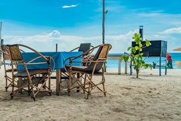 Table with chairs on the sand. Cafe on the beach, Nungwi, Zanzibar, Tanzania