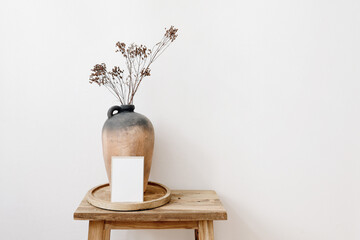 Elegant minimal stationery mockup. Blank greeting card, invitation. Rustic clay vase, pitcher with...