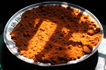 Chili powder on a plate, organic chili powder