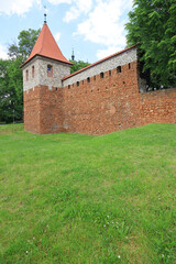 Fototapeta na wymiar A tower and a fragment of city walls from the 14th century near Krakow, Olkusz, Poland