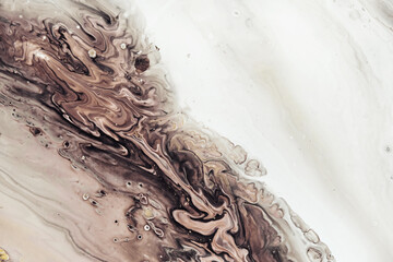 Fluid Art acrylic paints. Abstract mixing brown, black and white waves. Liquid flows splashes....
