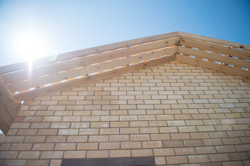 A brick house under construction, an unfinished structure.