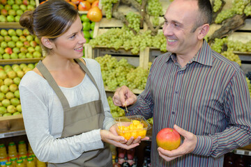 tasting the free sample of fruit
