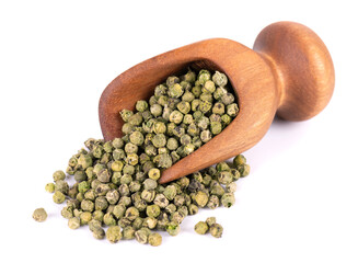Green peppercorns in wooden scoop, isolated on white background. Organic spice. Dry green pepper grain.