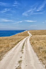 Winding road next to a cliff on the Black Sea coast in Crimea.