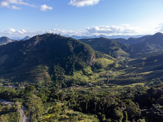 Fototapeta na wymiar beautiful green valley with coffee, eucalyptus and banana plantation, drone aerial view - Venda Nova, Espirito Santo, Brazil
