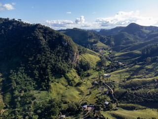 beautiful green valley with coffee, eucalyptus and banana plantation, drone aerial view - Venda...