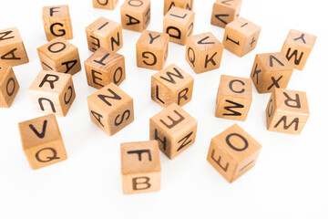 cube letters on a wooden table as a background