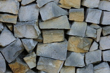Stone wall background (pieces of limestone)