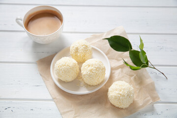 traditional homemade coconat coockies staked on a wooden table, blurred background. Copy space