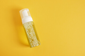 Blank mockup cosmetic package on yellow background