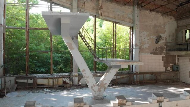 
diving tower in an abandoned pool in the city of pripyat
