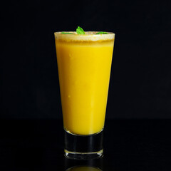 Pumpkin pie martini Halloween cocktail made with cinnamon, Irish cream liqueur, pumpkin puree, vanilla vodka with a granulated sugar rim, a glass of yellow cocktail summer drinks on table black backgr