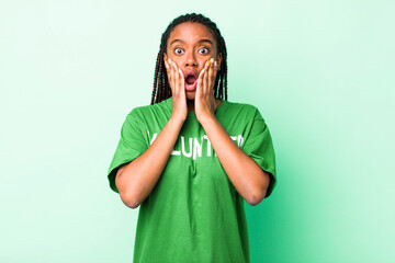 young adult black woman feeling shocked and scared