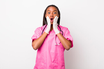 young adult black woman feeling shocked and scared. veterinarian concept