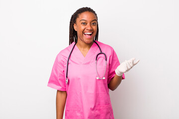 young adult black woman feeling happy, surprised realizing a solution or idea. veterinarian concept