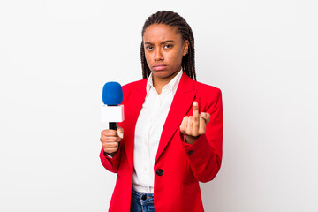young adult black woman feeling angry, annoyed, rebellious and aggressive. presenter and microphone...